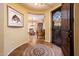 Welcoming foyer with tile flooring and an intricate mosaic design at 23236 N Caleta Ct, Sun City West, AZ 85375