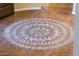 Beautiful tile design inlay sets an elegant tone in the home's foyer and entryway at 23236 N Caleta Ct, Sun City West, AZ 85375