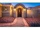 Beautiful gate entry with a stone pathway and desert landscaping at 23236 N Caleta Ct, Sun City West, AZ 85375