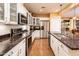 This spacious kitchen boasts stainless appliances, granite counters, and ample counter space at 23236 N Caleta Ct, Sun City West, AZ 85375