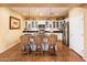 Bright kitchen with a central island, bar stool seating, and modern appliances at 23236 N Caleta Ct, Sun City West, AZ 85375