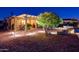 Well-lit outdoor patio with dining space and BBQ, with low maintenance desert landscaping at 23236 N Caleta Ct, Sun City West, AZ 85375