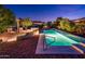 Exterior image featuring a private pool, desert landscaping, and a stone patio at 23236 N Caleta Ct, Sun City West, AZ 85375