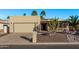 Desert home showcasing xeriscaping, a garage, a mail box, and a front entry under an overhang at 26405 S Lakewood Dr, Sun Lakes, AZ 85248