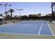 Well-maintained community tennis court with green and blue surface, net, and perimeter fencing at 26405 S Lakewood Dr, Sun Lakes, AZ 85248