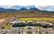 Aerial view of a community center with pools, clubhouse and green golf course at 26578 W Piute Ave, Buckeye, AZ 85396