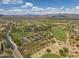 Picturesque aerial view of the community highlighting the tennis courts, golf course and mountain scenery at 29304 N Horton Creek Trl, Rio Verde, AZ 85263