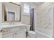 Bright bathroom featuring marble tile, a shower-tub combination, and a vanity sink with a mirror at 29304 N Horton Creek Trl, Rio Verde, AZ 85263