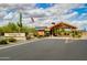 Inviting community entrance with lush landscaping, a modern gatehouse, and clear signage at 29304 N Horton Creek Trl, Rio Verde, AZ 85263