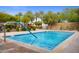 Inviting therapy pool features convenient handrails and a serene environment surrounded by mature landscaping at 29304 N Horton Creek Trl, Rio Verde, AZ 85263