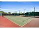 Well-maintained tennis court with professional lighting and manicured surroundings for the avid player at 29304 N Horton Creek Trl, Rio Verde, AZ 85263