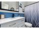 Renovated bathroom showcasing a modern vanity, blue accent wall, and stylish fixtures at 3031 W Cottonwood Ln, Phoenix, AZ 85045