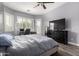 Serene bedroom with ample natural light and a ceiling fan for comfortable living at 3031 W Cottonwood Ln, Phoenix, AZ 85045