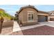 Charming home featuring a well-kept lawn, desert landscaping and an attached two-car garage at 3031 W Cottonwood Ln, Phoenix, AZ 85045