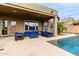 Covered patio featuring outdoor furniture next to a pool at 3031 W Cottonwood Ln, Phoenix, AZ 85045