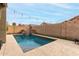 Backyard swimming pool featuring a rock waterfall at 3031 W Cottonwood Ln, Phoenix, AZ 85045