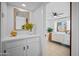 Bright bedroom featuring stylish vanity area and sliding doors leading to backyard at 3033 N 37Th St # 14, Phoenix, AZ 85018