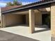 Spacious covered carport offering ample parking, a neutral color palette, and convenient access to the house at 3033 N 37Th St # 14, Phoenix, AZ 85018