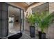 Inviting entryway with desert landscaping, and a glimpse into the open-concept living area with fireplace at 3033 N 37Th St # 14, Phoenix, AZ 85018