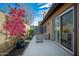 Relaxing outdoor patio with comfortable seating, mature bougainvillea and direct access to the house via a sliding glass door at 3033 N 37Th St # 14, Phoenix, AZ 85018