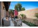 Charming patio space with comfortable seating, vibrant bougainvillea, and a lush, inviting ambiance at 3033 N 37Th St # 14, Phoenix, AZ 85018