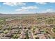 Great aerial shot of the vast community with desert scenery, well-kept streets, and beautiful mountain views at 30480 N 128Th Ln, Peoria, AZ 85383