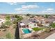 Beautiful aerial view showcasing a private pool, backyard patio, desert landscaping, and a cozy outdoor living space at 30480 N 128Th Ln, Peoria, AZ 85383