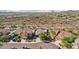 Beautiful aerial view of the house features desert surroundings, nearby street, and well-manicured landscaping at 30480 N 128Th Ln, Peoria, AZ 85383