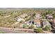 Aerial shot of the backyard, showcasing a private pool, outdoor patio, and lush landscaping at 30480 N 128Th Ln, Peoria, AZ 85383