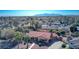 Aerial view of a residential area showcasing single-Gathering homes, mature trees, and a red tile roof at 315 W Sonoma Dr, Litchfield Park, AZ 85340