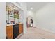 A bar area features a mini-fridge, wood cabinets, and a marble countertop with a sink at 315 W Sonoma Dr, Litchfield Park, AZ 85340