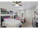 Bedroom with two beds, ceiling fan and decorations at 315 W Sonoma Dr, Litchfield Park, AZ 85340