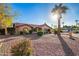 Charming single-story home features a tile roof, arched windows, and a beautifully xeriscaped front yard with mature landscaping at 315 W Sonoma Dr, Litchfield Park, AZ 85340