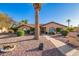 Charming single-story home features a tile roof, arched windows, and a beautifully xeriscaped front yard with mature landscaping at 315 W Sonoma Dr, Litchfield Park, AZ 85340