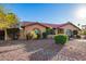 Charming single-story home features a tile roof, arched windows, and a beautifully xeriscaped front yard with mature landscaping at 315 W Sonoma Dr, Litchfield Park, AZ 85340