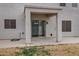 The covered patio features a sliding glass door and textured pillars at 342 E Backman St, San Tan Valley, AZ 85140