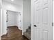 Hallway with carpeted stairs, wood-look flooring, and natural light flowing in from adjacent rooms at 342 E Backman St, San Tan Valley, AZ 85140