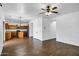 Open-concept living area with new flooring, ceiling fan, and seamless access to the kitchen at 342 E Backman St, San Tan Valley, AZ 85140