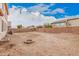 Spacious dirt backyard featuring a fire pit, ready for personalization at 38274 N Tumbleweed Ln, San Tan Valley, AZ 85140