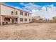 A view of the home's backyard, including a covered patio and fire pit at 38274 N Tumbleweed Ln, San Tan Valley, AZ 85140