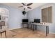 Open living room with ceiling fan, hardwood floors, and an open hallway at 38274 N Tumbleweed Ln, San Tan Valley, AZ 85140