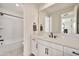 Modern bathroom featuring double sink vanity, white cabinets, and black hardware at 3964 E Penedes Dr, Gilbert, AZ 85298