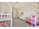 Bedroom with a bunk bed, ceiling fan, window, and pink accents at 3964 E Penedes Dr, Gilbert, AZ 85298