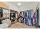 Spacious walk-in closet with organized shelving, hanging rods, and a Louis Vuitton box at 3964 E Penedes Dr, Gilbert, AZ 85298