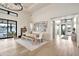 Bright dining area with hardwood floors, modern table, and a view to the pool at 3964 E Penedes Dr, Gilbert, AZ 85298