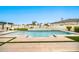 Beautiful pool with water features surrounded by lush landscaping and travertine at 3964 E Penedes Dr, Gilbert, AZ 85298