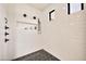 Modern shower with white subway tile walls, hexagon tile floor, a rain shower head, and black accents at 3964 E Penedes Dr, Gilbert, AZ 85298