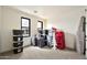 Storage room with neutral carpet, natural light, and ample room for organizing at 3964 E Penedes Dr, Gilbert, AZ 85298