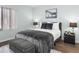 Comfortable bedroom featuring a stylish bed and convenient nightstands with lamps at 402 E Muriel Dr, Phoenix, AZ 85022