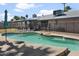 Backyard swimming pool and patio with multiple seating and grilling areas; ideal for entertaining at 402 E Muriel Dr, Phoenix, AZ 85022